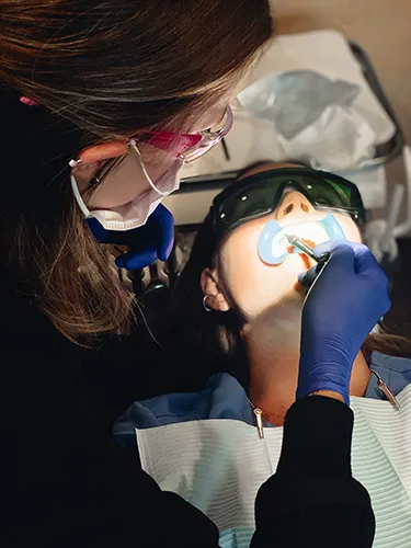 Patient receiving teeth whitening